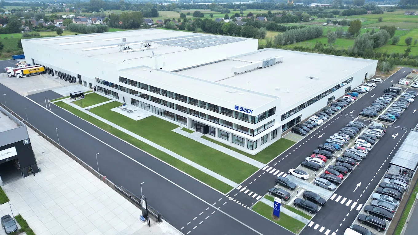 Brady and Twintag representatives at a Brady production facility